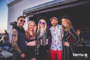 Group of friends smiling for photo at sunrise in Las Vegas Afterhours club