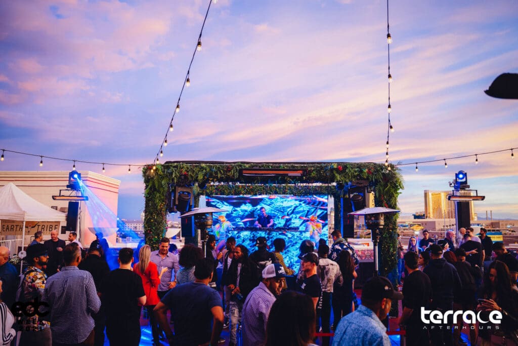 Crowd dancing under sunrise at Las Vegas Afterhours club