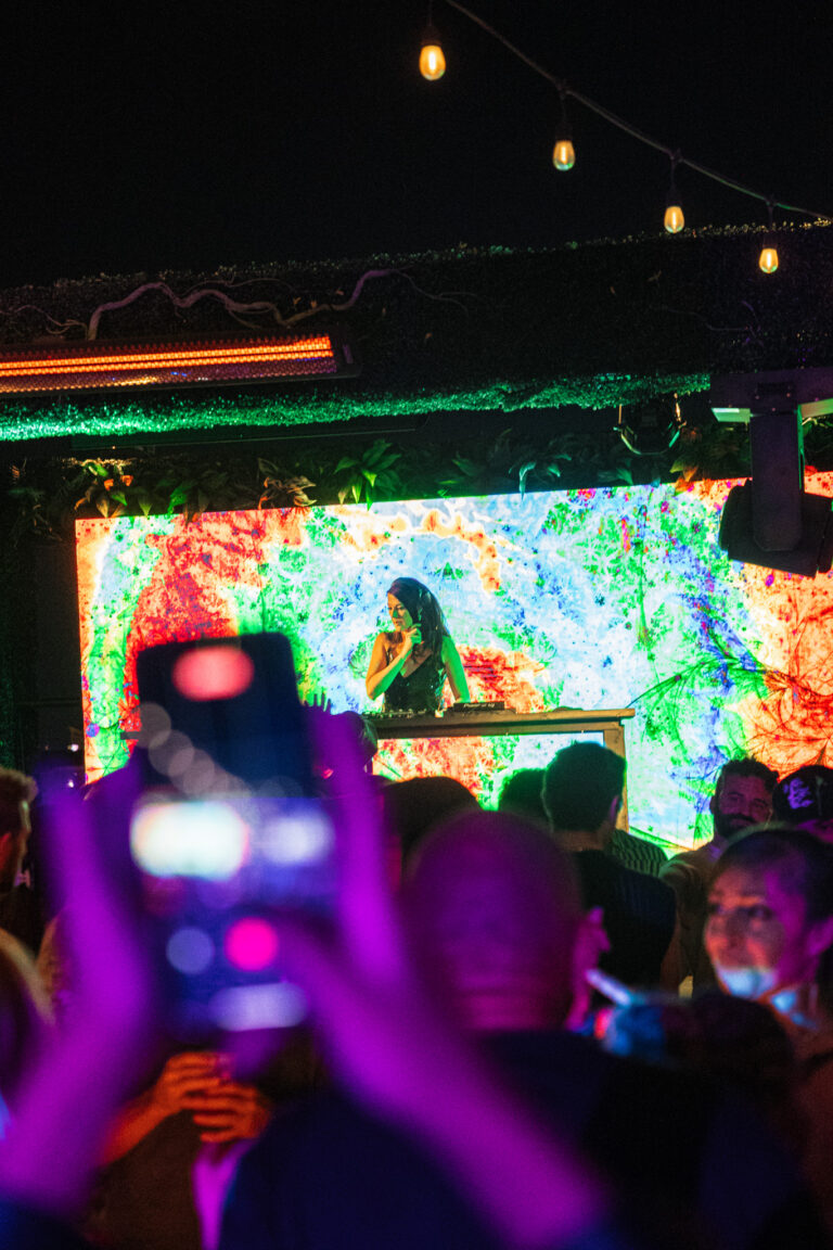 Guest taking picture of DJ performing at Terrace Afterhours club in Las Vegas