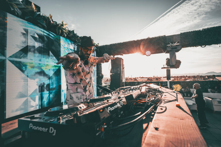 DJ performing at Terrace Afterhours rooftop with sunset in Las Vegas