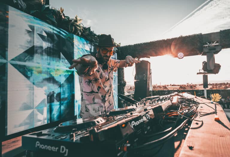DJ performing at Terrace Afterhours rooftop with sunset in Las Vegas