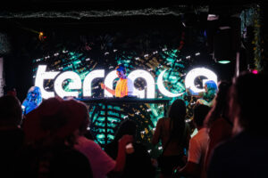 crowd dancing at Terrace Afterhours nightclub in Las Vegas with DJ and LED visuals