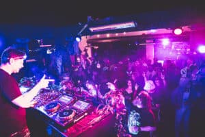 Crowd dancing to underground house music set at Terrace Afterhours club in Las Vegas