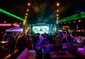 crowd dancing to house music at Terrace Afterhours rooftop in Las Vegas at night