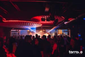 crowd dancing at Terrace Afterhours with DJ, lighting, and stage design in Las Vegas
