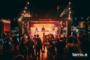 people dancing in front of the Terrace Afterhours nightclub stage
