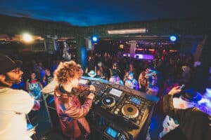 DJ performing at open-air rooftop venue in Las vegas